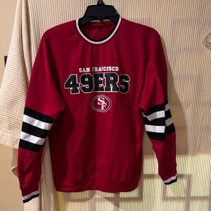 NFL San Francisco 49ers crewneck shirt graphic logo and decorative stripes.